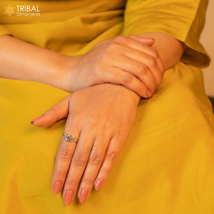 Sterling silver flower design ring by TRIBAL ORNAMENTS showcasing intricate floral jewelry craftsmanship.