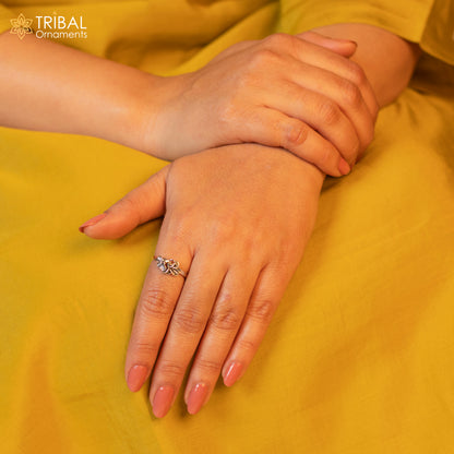 Sterling silver flower design ring by TRIBAL ORNAMENTS featuring intricate floral jewelry craftsmanship.