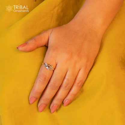 Sterling silver flower design ring by TRIBAL ORNAMENTS, showcasing intricate floral jewelry craftsmanship.
