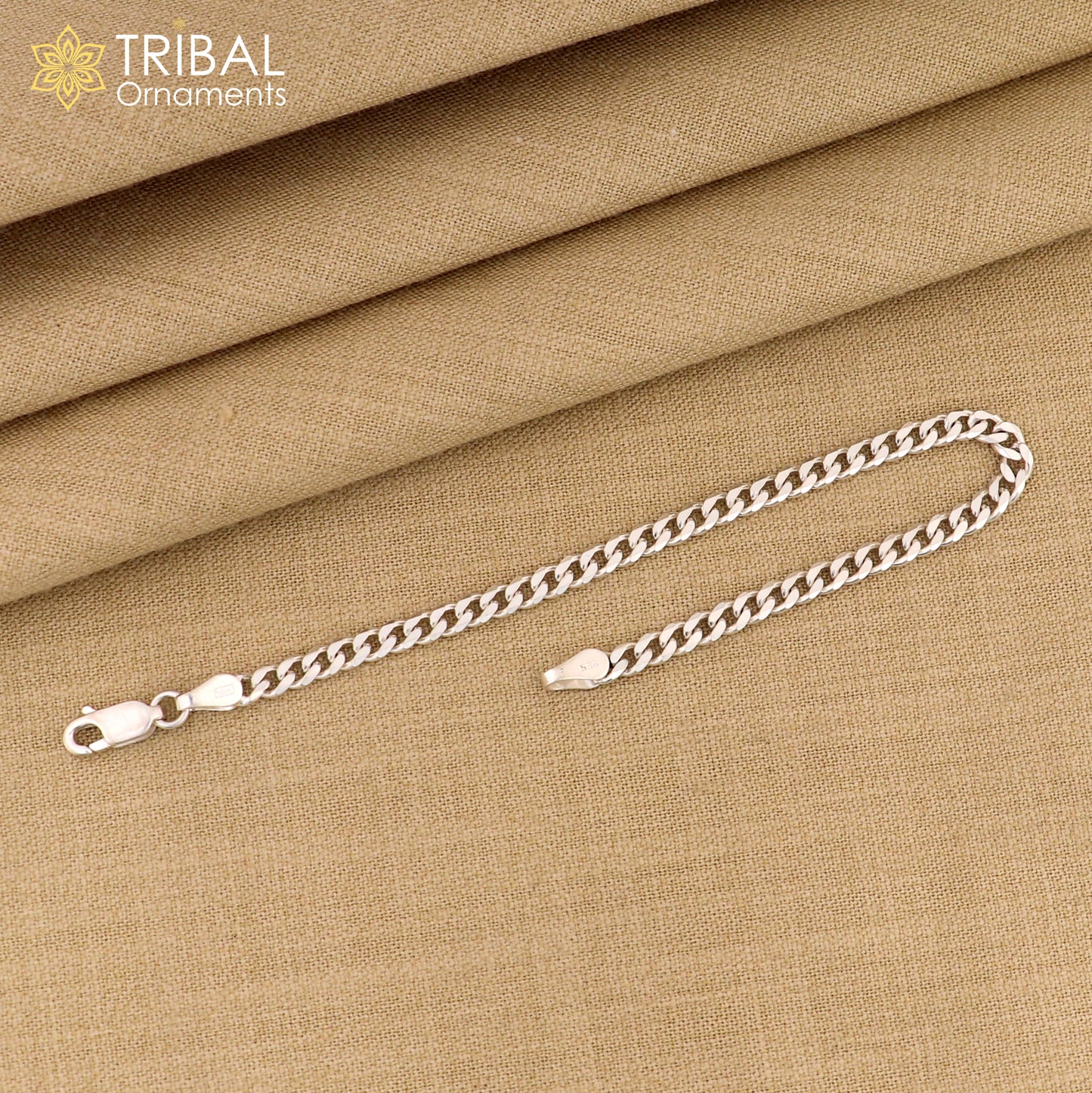 Sterling silver 3mm flat chain bracelet by Tribal Ornaments, flexible unisex jewelry with a sleek, minimalist design.