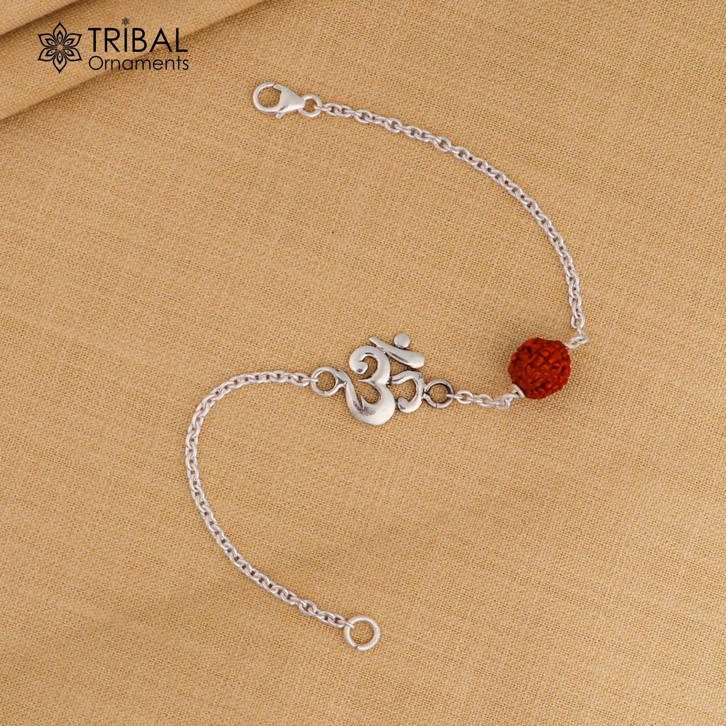 Unisex silver bracelet with Aum/Om design and Rudraksha beads, crafted from 925 sterling silver, featuring a chain style jewelry piece.