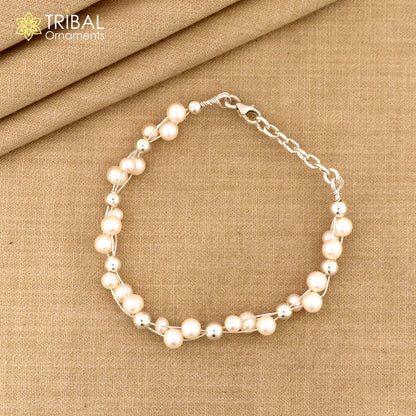 Sterling silver beaded bracelet with natural pearl accents, unisex design, tribal ornaments jewelry, perfect for gifting.