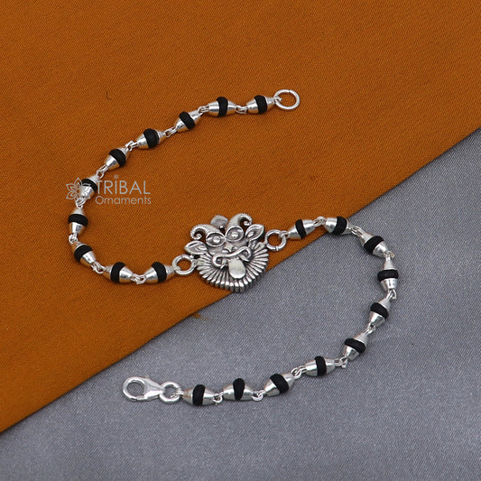 Sterling silver Evil Eye Nazar Battu bracelet with black Tulsi beads and basil rosary, handcrafted by Tribal Ornaments.