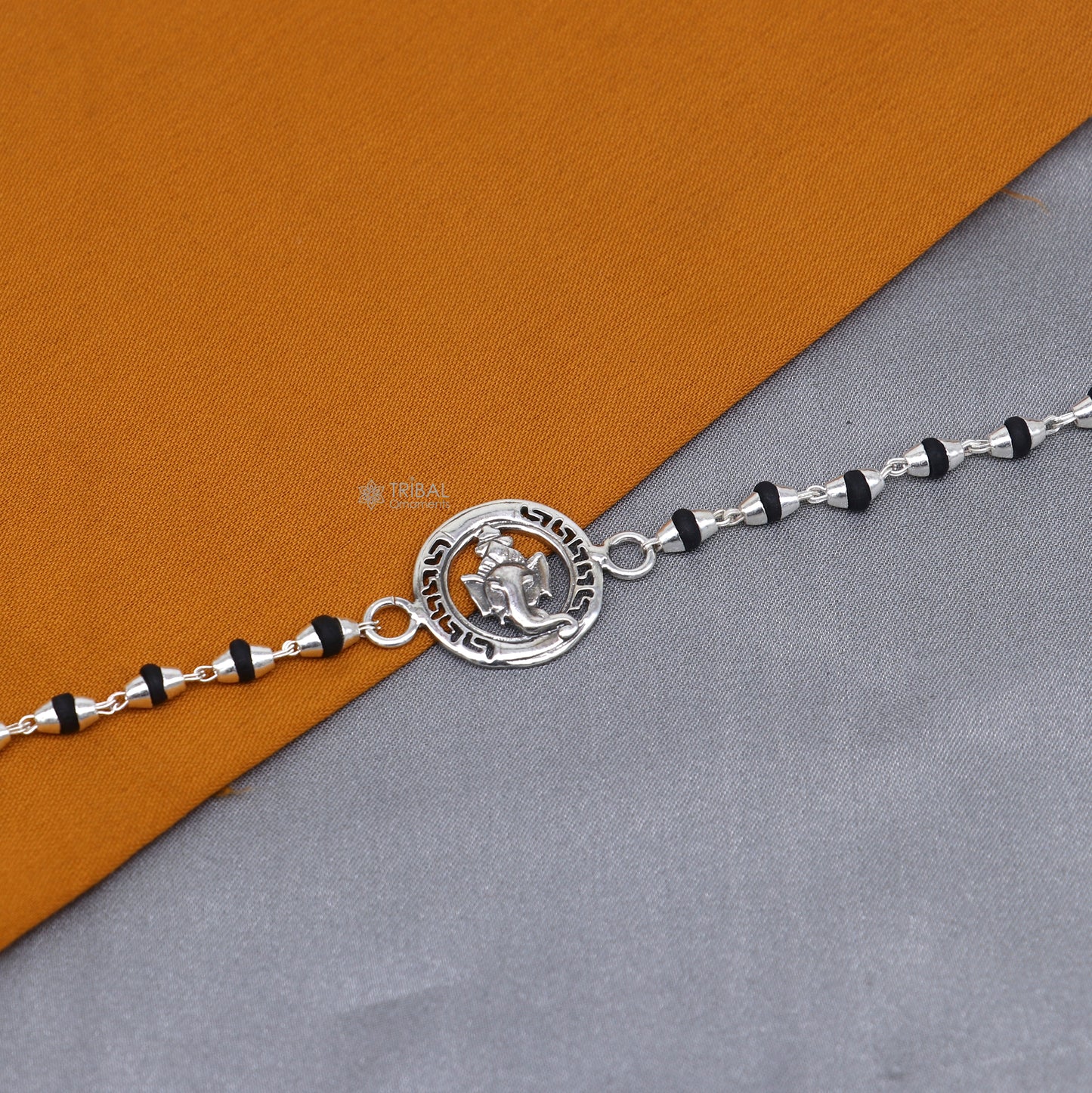 925 sterling silver Lord Ganesha design rosary beads bracelet with black Tulsi beads, handmade by Tribal Ornaments.