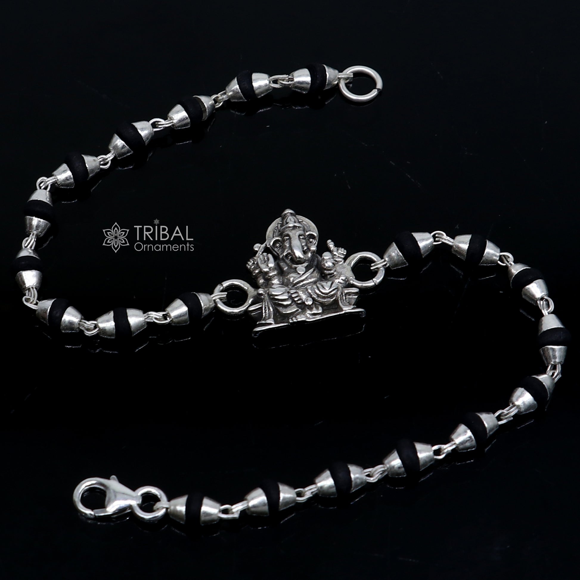 925 silver Lord Ganesha design black Tulsi beads bracelet rakhi with handmade silver Ganesha charm and holy basil beads.