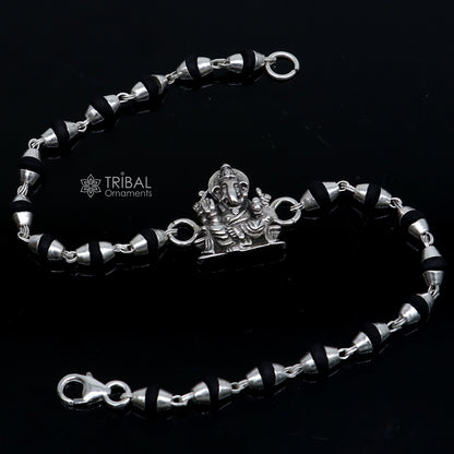 925 silver Lord Ganesha design black Tulsi beads bracelet rakhi with handmade silver Ganesha charm and holy basil beads.