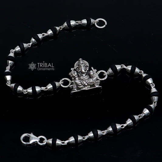 925 silver Lord Ganesha design black Tulsi beads bracelet rakhi with handmade silver Ganesha charm and holy basil beads.