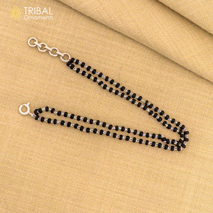 Tribal Ornaments 925 sterling silver 2-layer charm bracelet with black beads and 2.5 mm accents, handcrafted women's jewelry.