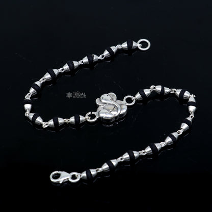 925 sterling silver Lord Ganesha beaded bracelet with black Tulsi beads, handmade tribal ornament design for spiritual wristwear.