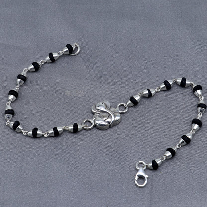 Sterling silver Lord Ganesha bracelet with black Tulsi beaded design and handmade Ganesha motif, from Tribal Ornaments.