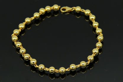 Sterling silver handmade beaded bracelet with polished gold accents, stylish unisex jewelry from Tribal Ornaments.