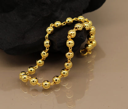 Sterling silver handmade beaded bracelet with gold polish from TRIBAL ORNAMENTS, stylish unisex jewelry with custom gift appeal