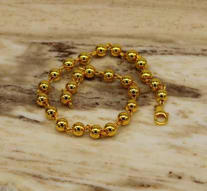 Sterling silver handmade beaded bracelet with gold polish from TRIBAL ORNAMENTS, stylish unisex jewelry for gifting or everyday wear