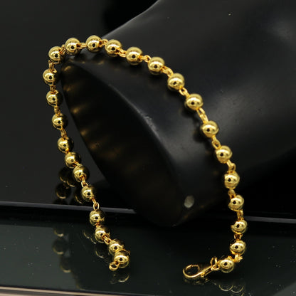Sterling silver handmade beaded bracelet with polished gold finish, stylish unisex jewelry, perfect for customized gifting.