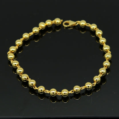 Sterling silver beaded bracelet with gold polish, handmade unisex jewelry by TRIBAL ORNAMENTS, stylish custom gift accessory