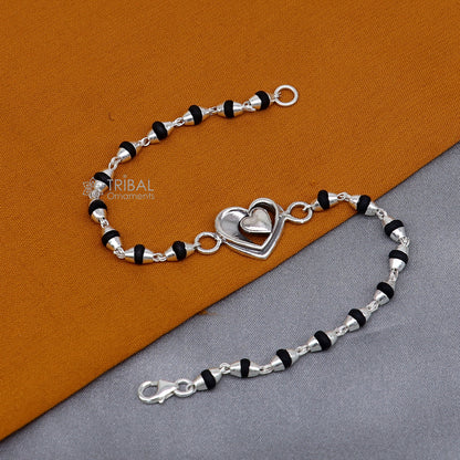 925 Sterling Silver Heart Design Black Tulsi Beads Bracelet from TRIBAL ORNAMENTS, featuring handmade silver heart accents and black beaded bracelet.