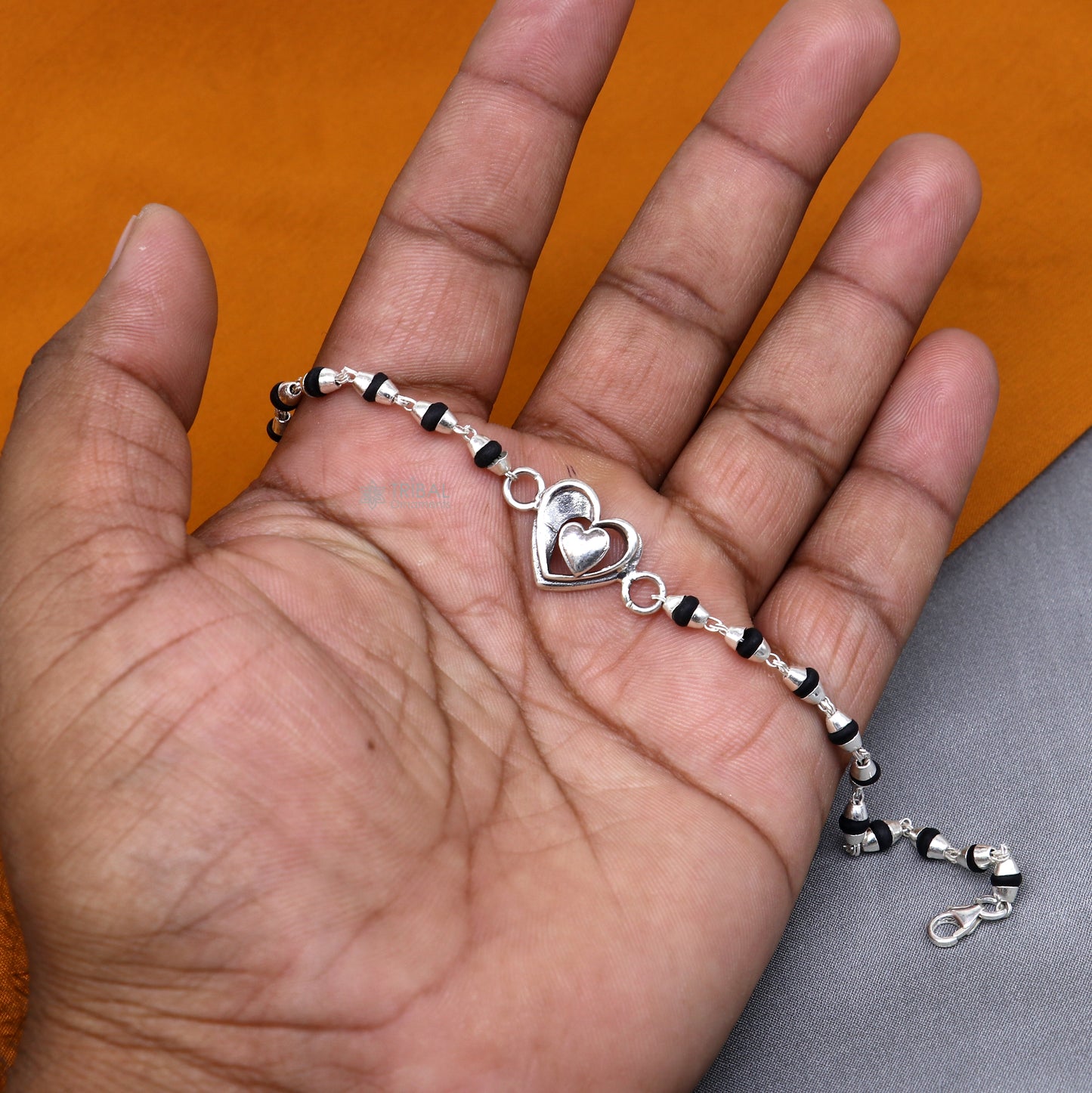 925 Sterling Silver Heart Design Black Tulsi Beads Bracelet with handmade tribal style for rakhi celebration.