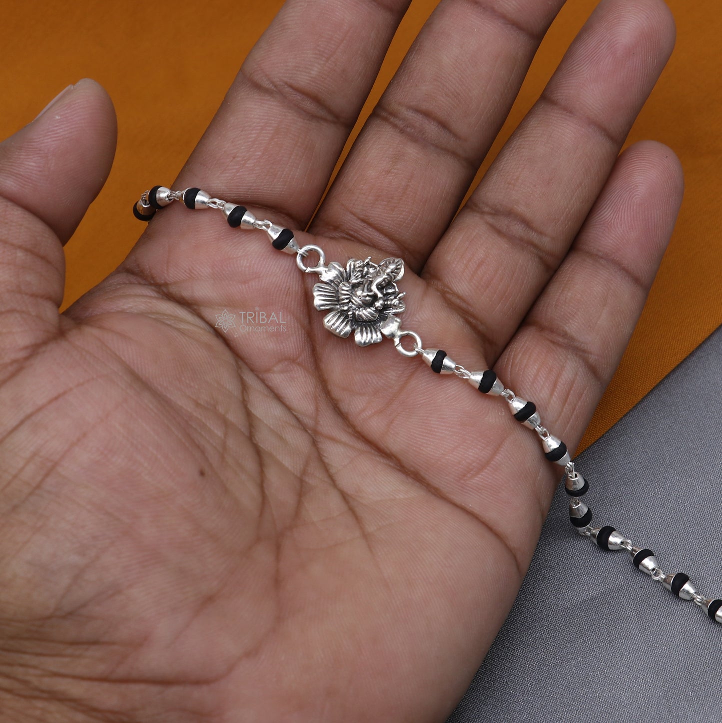 Sterling silver Lord Ganesha bracelet with black Tulsi beads and basil rosary beads, handmade tribal ornament jewelry.