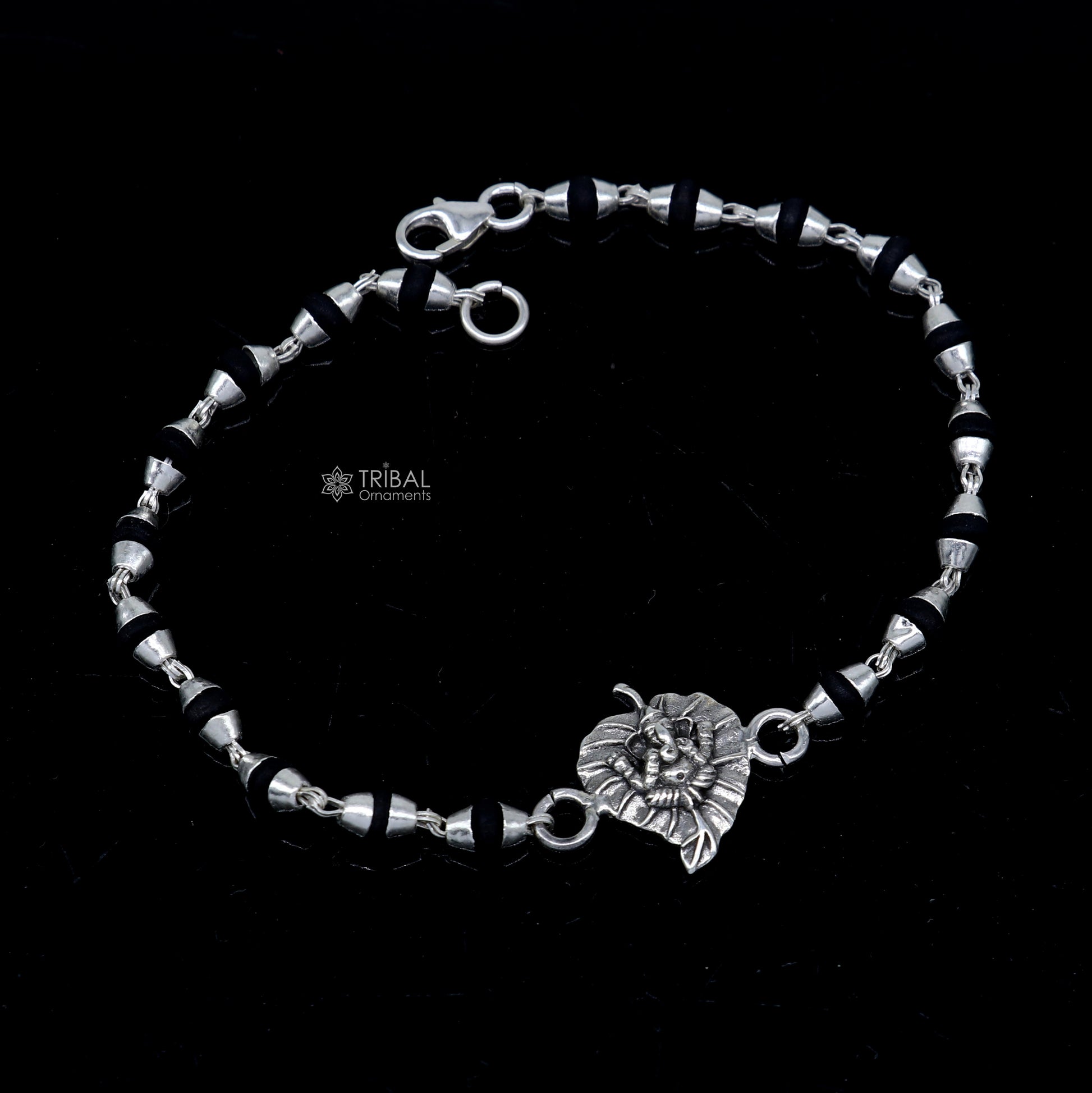 Sterling silver Lord Ganesha bracelet with black Tulsi beads and basil rosary beads, handcrafted by Tribal Ornaments.