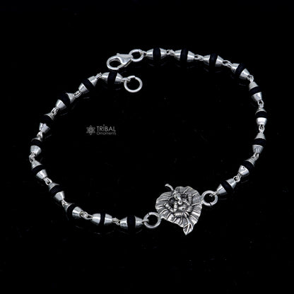 Sterling silver Lord Ganesha bracelet with black Tulsi beads and basil rosary beads, handcrafted by Tribal Ornaments.