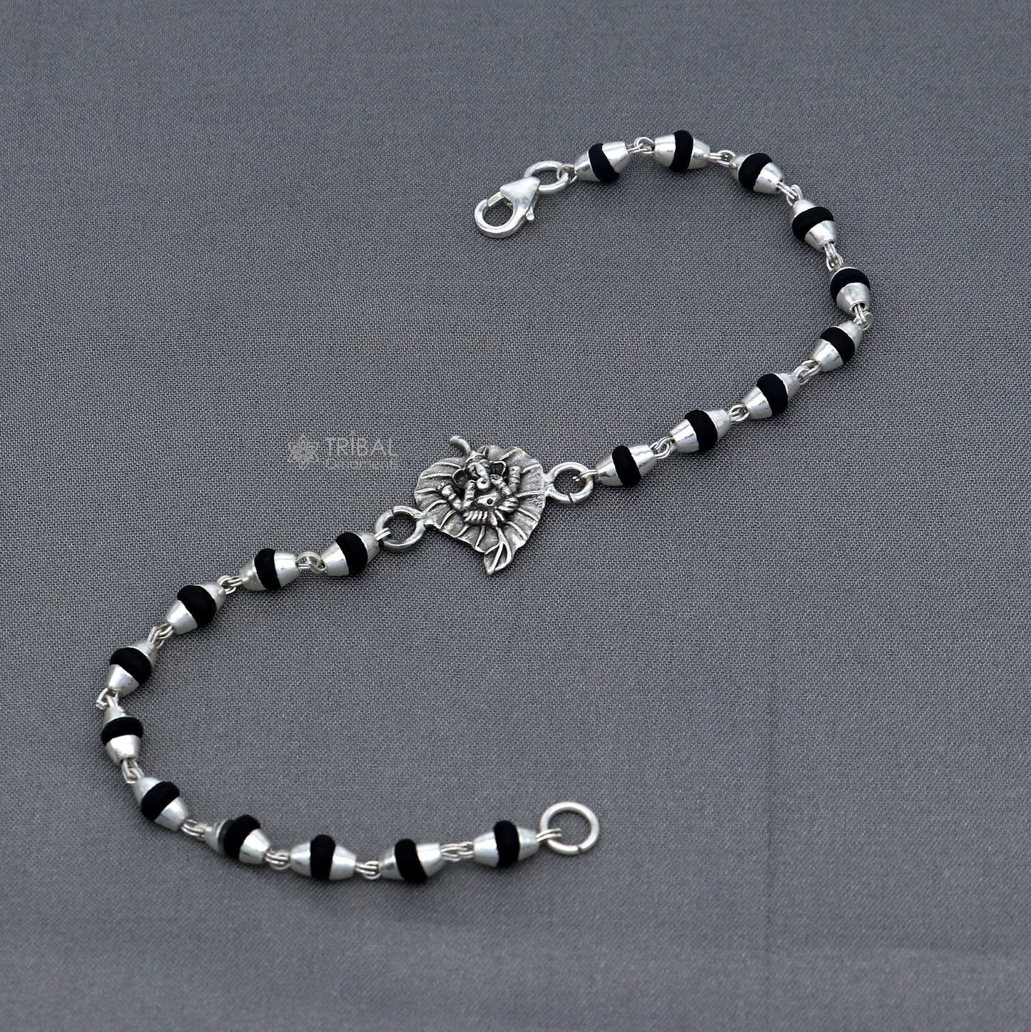 Sterling silver Lord Ganesha bracelet with black Tulsi beads and basil rosary beads, handmade tribal jewelry.