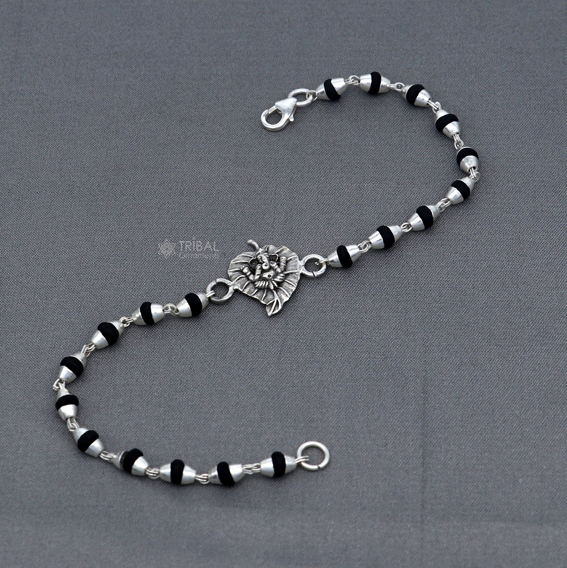 Sterling silver Lord Ganesha bracelet with black Tulsi beads and basil rosary beads, handmade tribal jewelry.