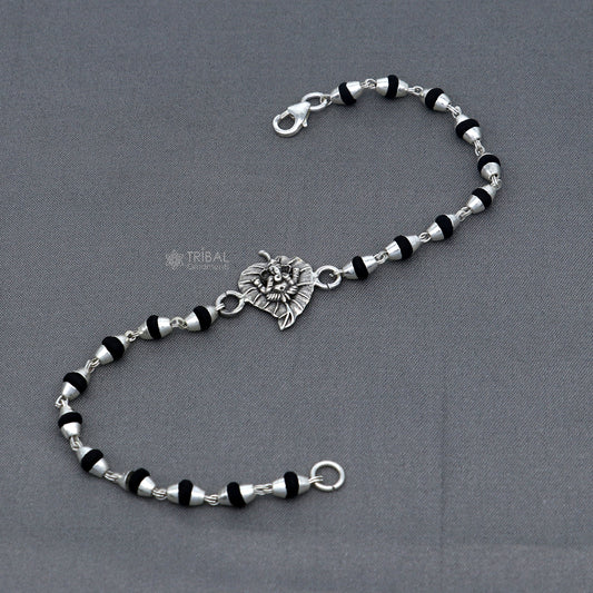 Sterling silver Lord Ganesha bracelet with black Tulsi beads and basil rosary beads, handmade tribal jewelry.