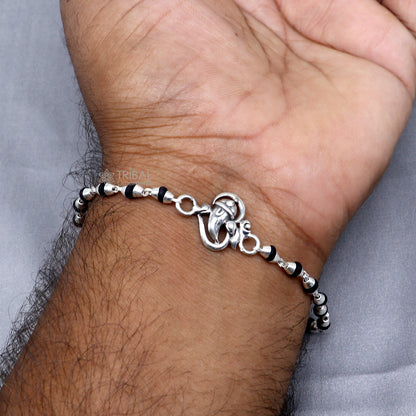Sterling silver Lord Ganesha bracelet with black Tulsi beads and holy basil rosary beads, handcrafted by TRIBAL ORNAMENTS.