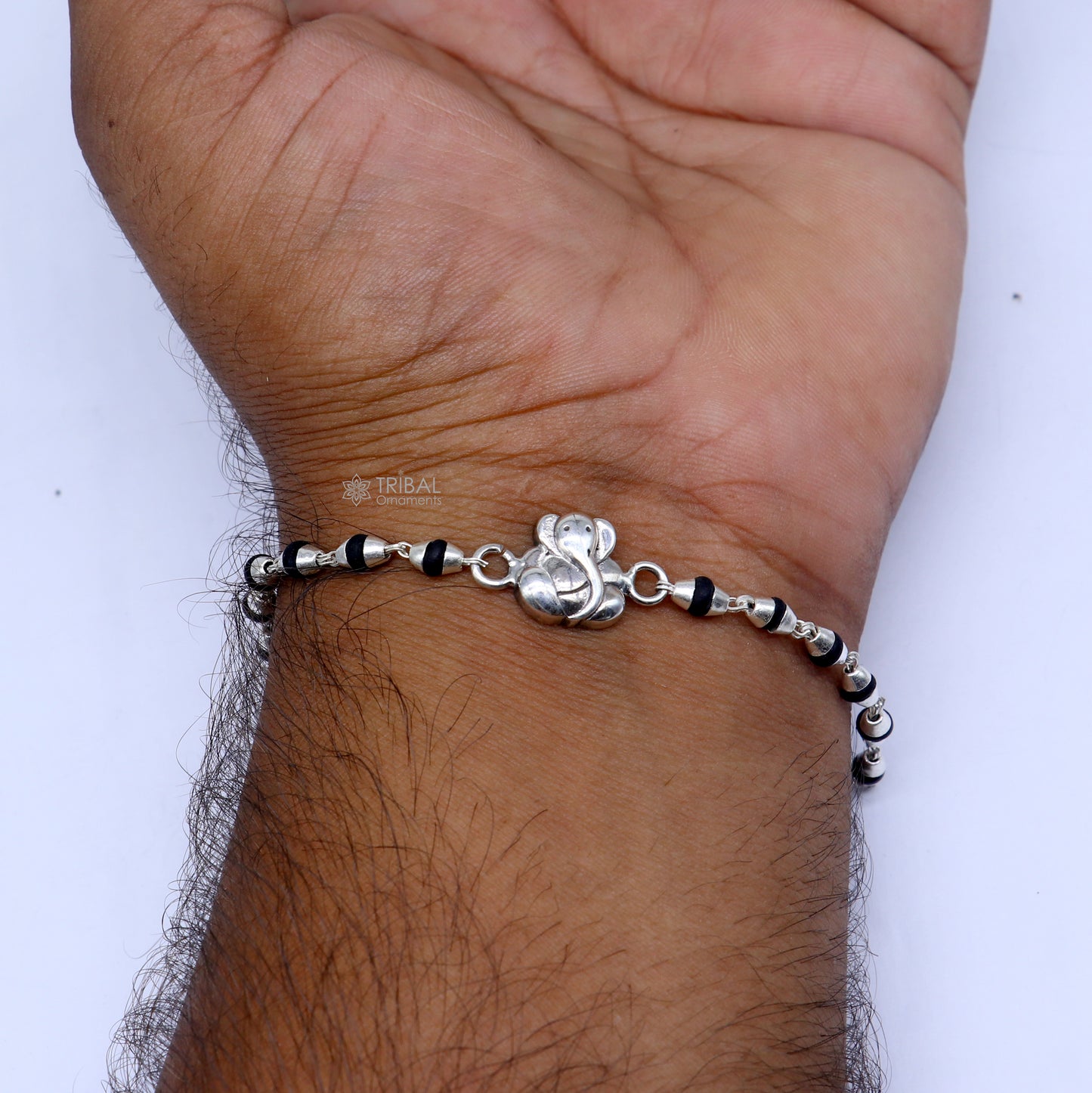 Handmade 925 sterling silver Lord Ganesha black Tulsi beaded bracelet with holy basil rosary beads, from TRIBAL ORNAMENTS.