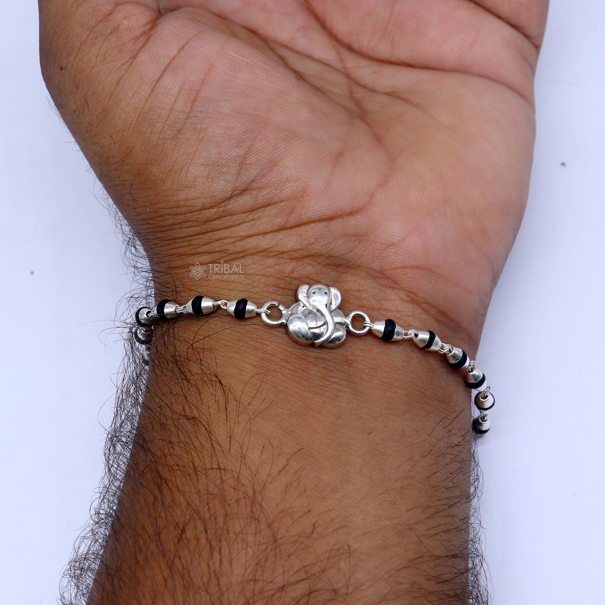 Handmade 925 sterling silver Lord Ganesha black Tulsi beaded bracelet with holy basil rosary beads, from TRIBAL ORNAMENTS.