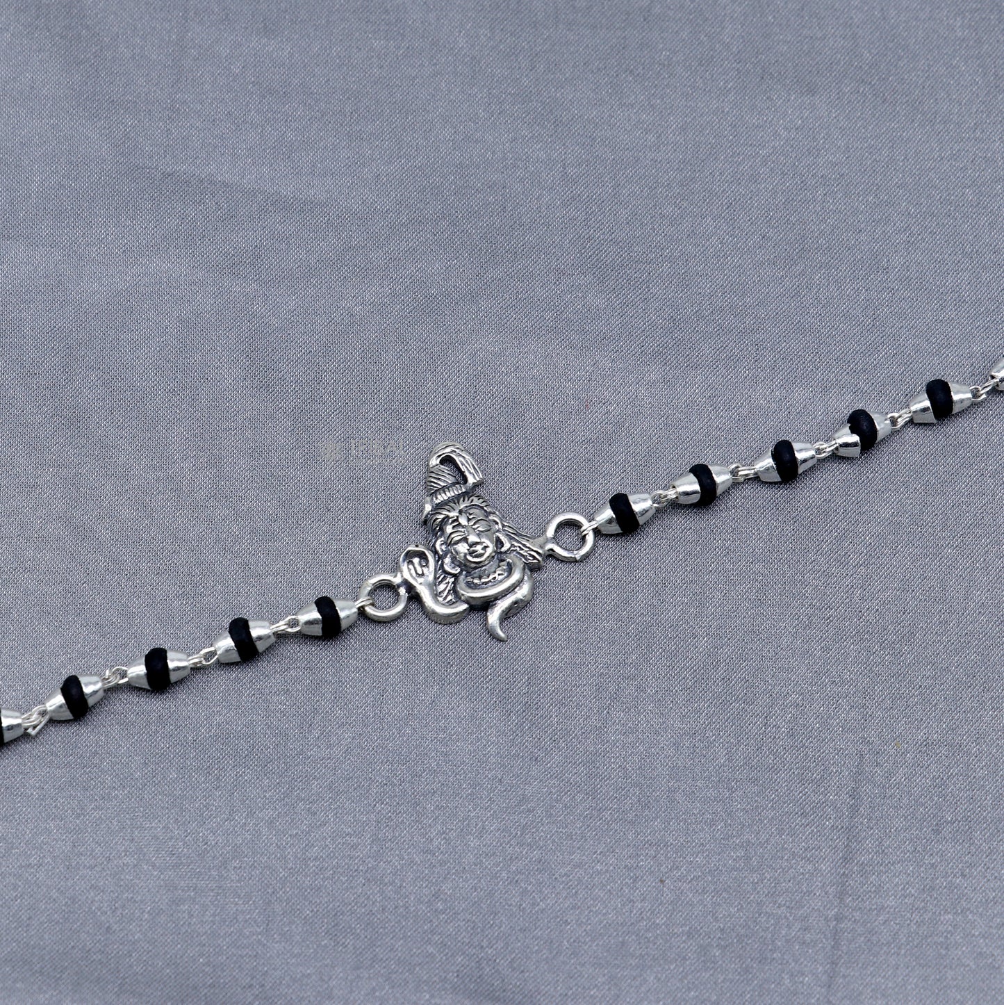 925 silver Lord Shiva black Tulsi beaded bracelet from TRIBAL ORNAMENTS featuring handmade silver beads and holy basil accents.