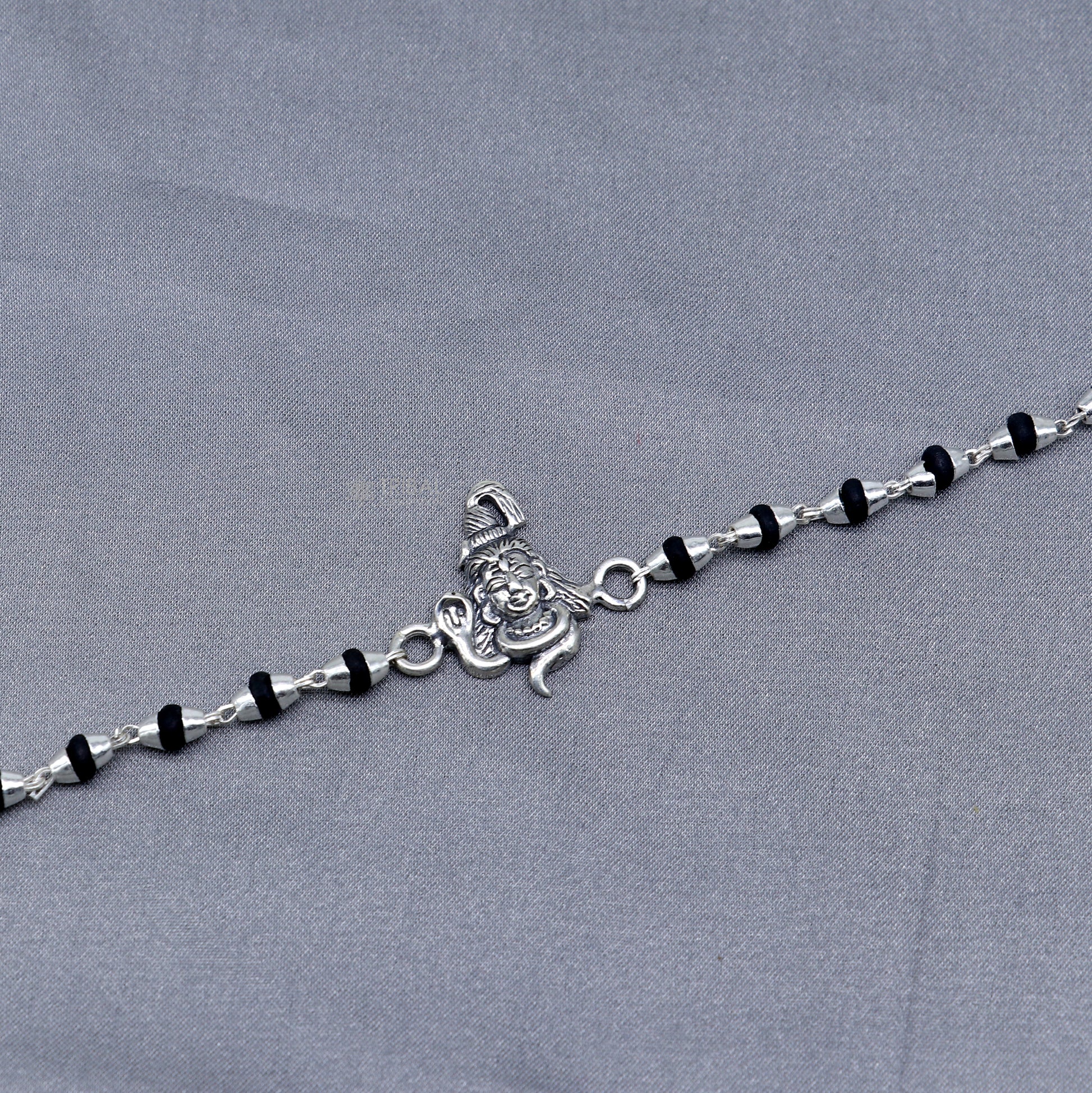 925 silver Lord Shiva black Tulsi beaded bracelet from TRIBAL ORNAMENTS featuring handmade silver beads and holy basil accents.