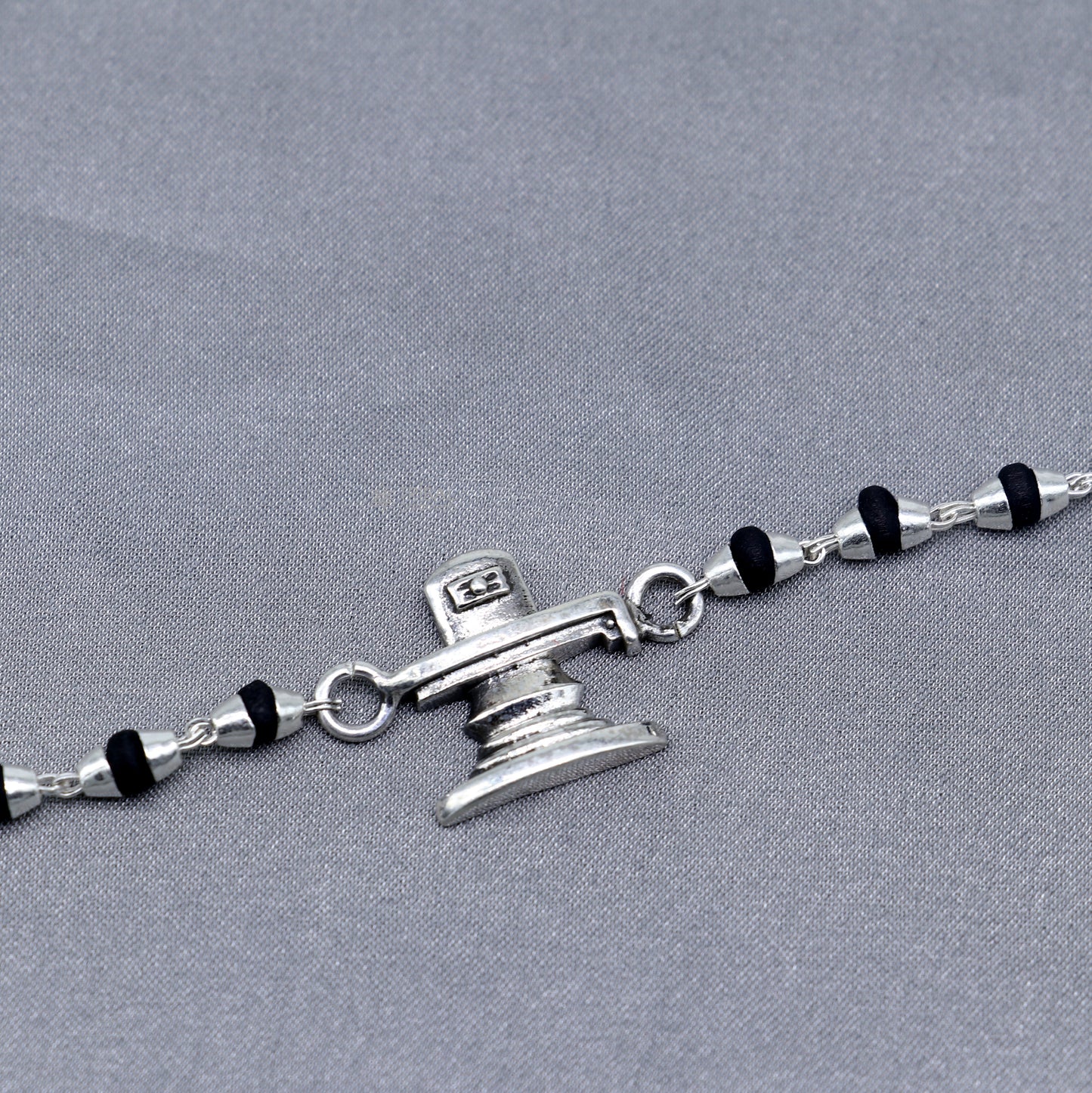 Sterling silver Lord Shiva Lingam bracelet with black Tulsi beads and basil rosary beads, handmade by Tribal Ornaments.