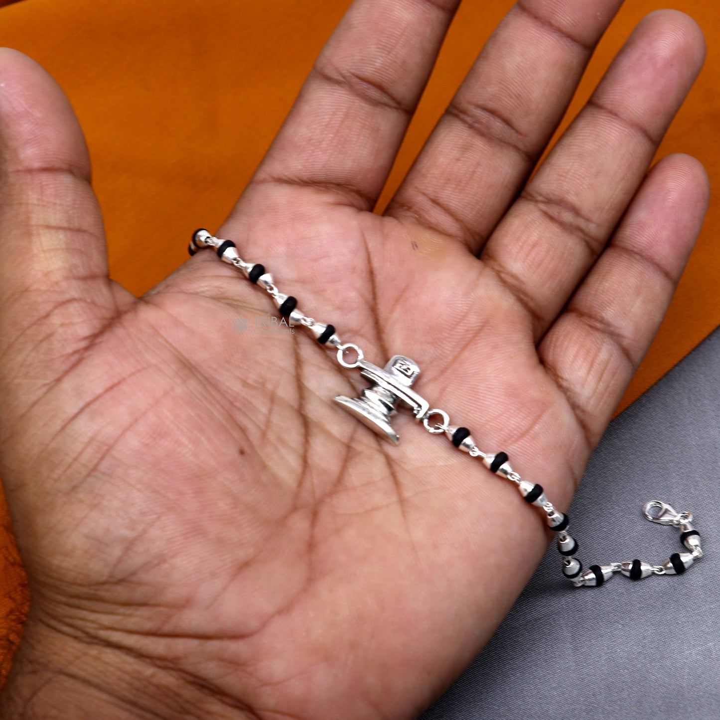 Sterling silver Lord Shiva Lingam bracelet with black Tulsi beads, handmade tribal ornament jewelry, traditional spiritual accessory.
