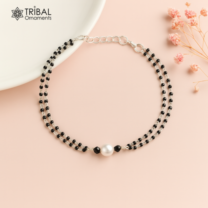 Sterling silver bracelet with black beads and double chain design, featuring pearl accents, suitable as bracelet, anklet, or mangalsutra.