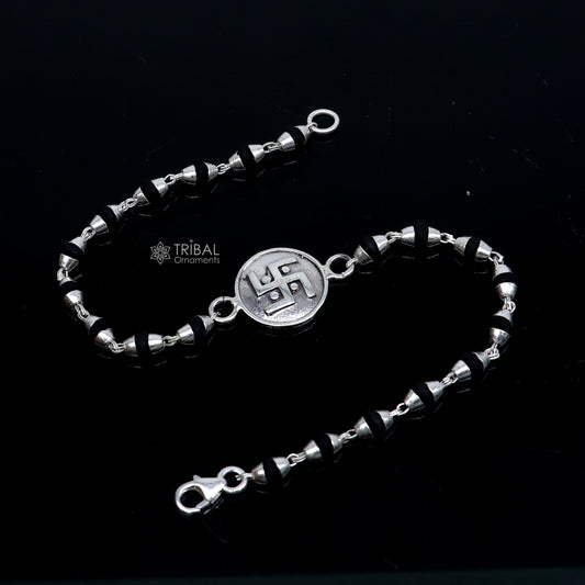 Sterling silver Swastik design black Tulsi beads bracelet with holy basil beads, crafted by TRIBAL ORNAMENTS.