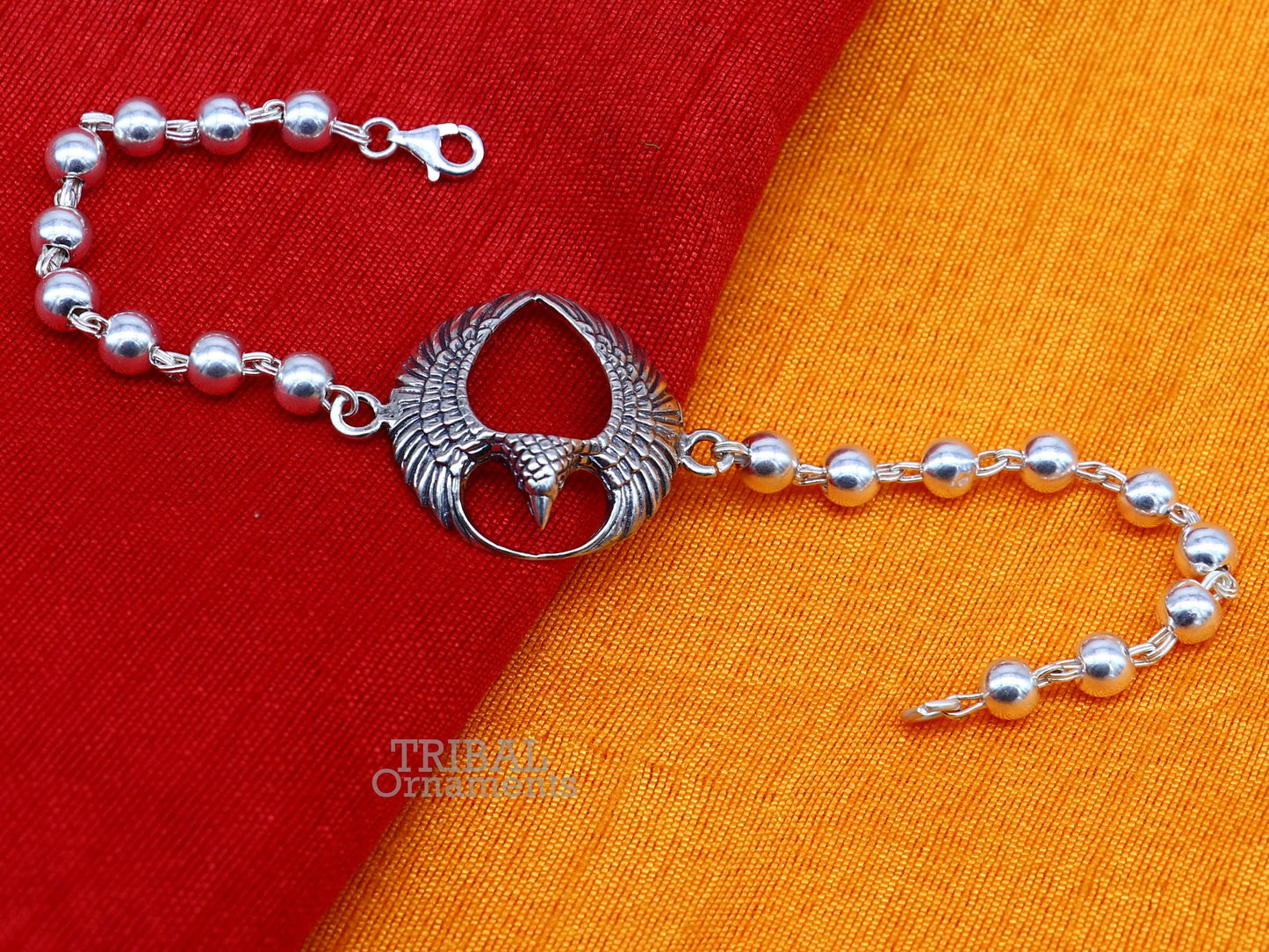 925 silver Lord Garuda design Tulsi beaded bracelet rakhi by TRIBAL ORNAMENTS featuring black basil beads and intricate silver craftsmanship.