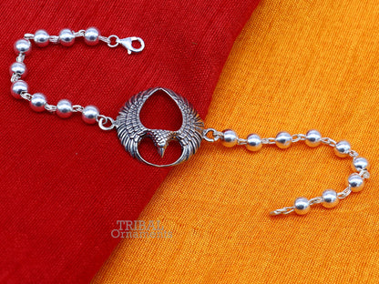 925 silver Lord Garuda design Tulsi beaded bracelet rakhi by TRIBAL ORNAMENTS featuring black basil beads and intricate silver craftsmanship.