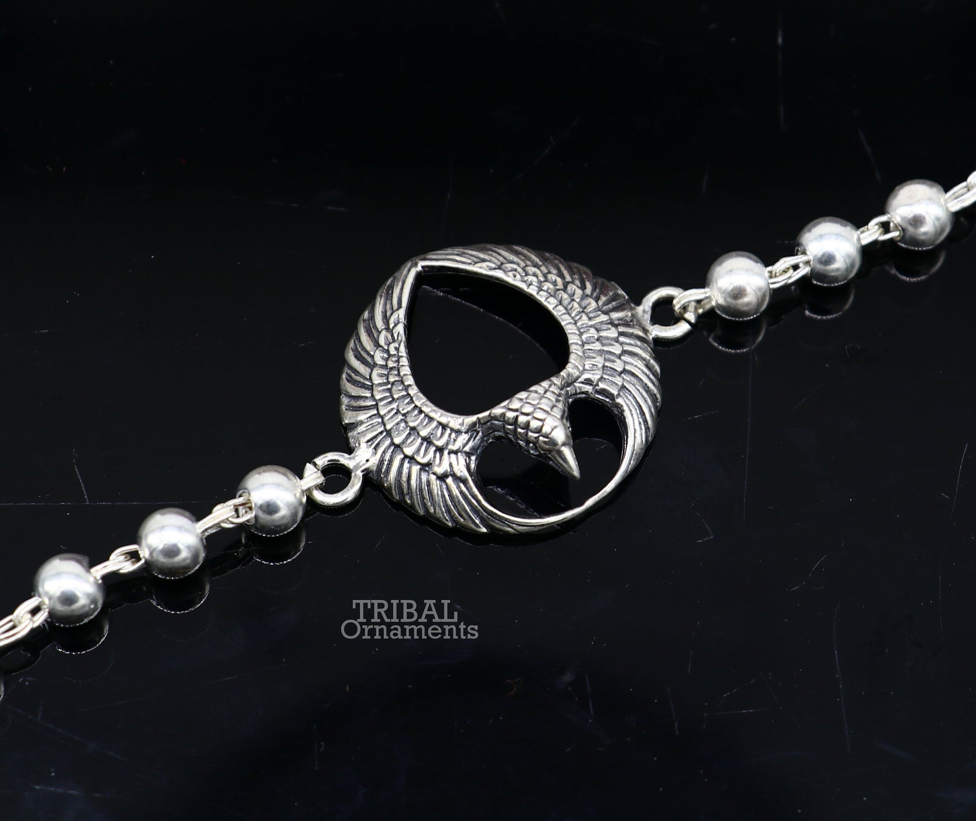 925 sterling silver Lord Garuda design Tulsi beaded bracelet Rakhi with basil rosary beads, handcrafted by Tribal Ornaments.