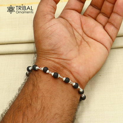 Sterling silver Karungali black beads bracelet by TRIBAL ORNAMENTS, unisex jewelry, 6-inch silver bracelet with black bead details.