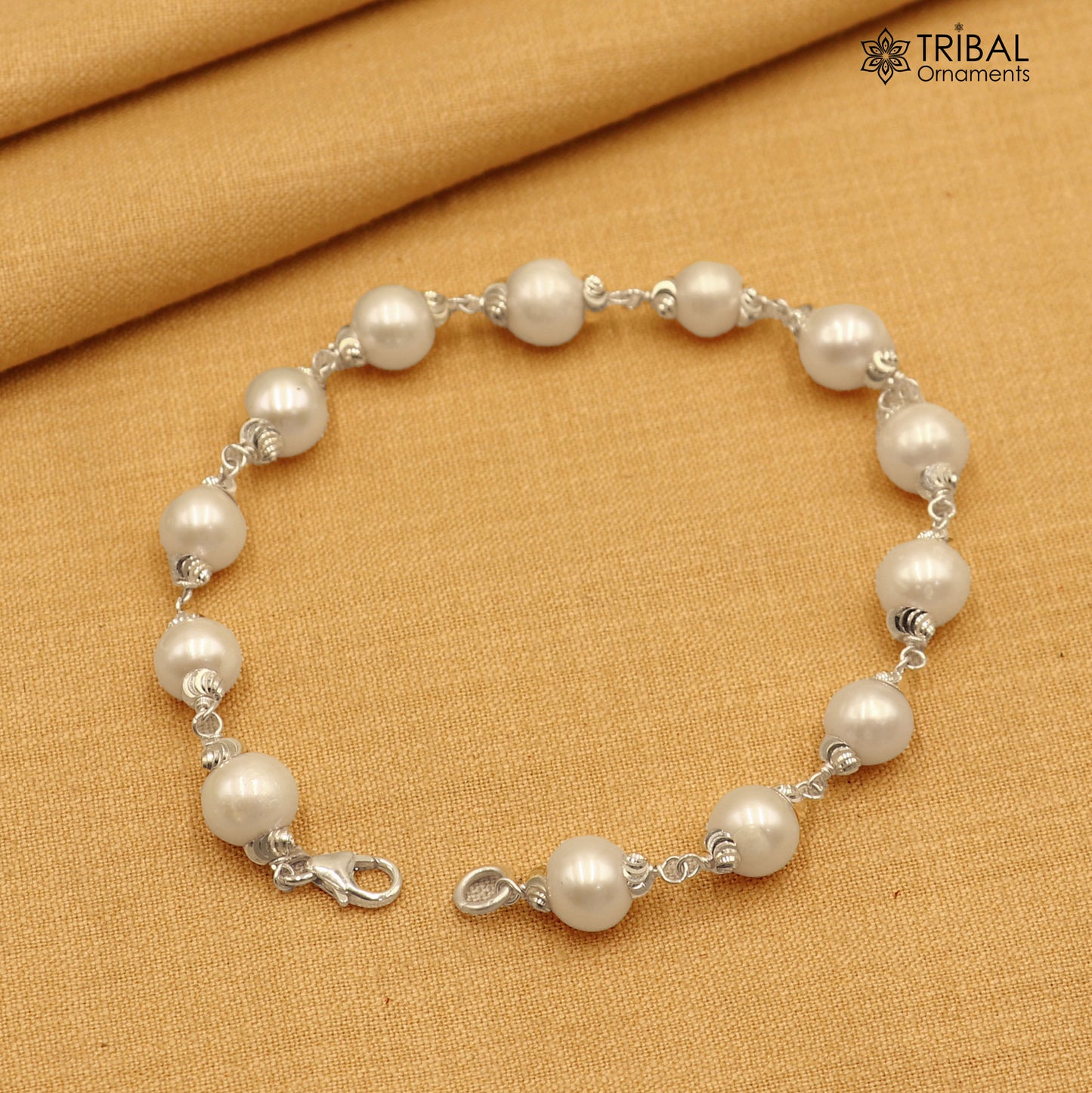 925 Sterling silver pearl beads bracelet for unisex jewelry by TRIBAL ORNAMENTS, featuring a 6-inch silver bracelet with pearl accents.