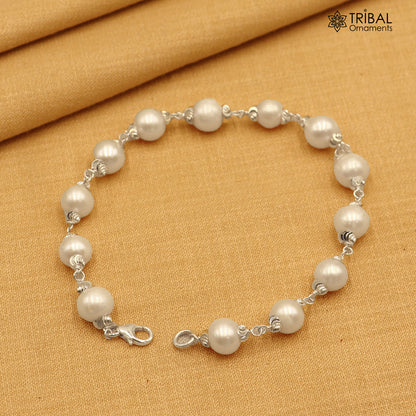 925 Sterling silver pearl beads bracelet for unisex jewelry by TRIBAL ORNAMENTS, featuring a 6-inch silver bracelet with pearl accents.