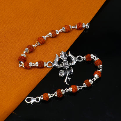 Sterling silver Rudraksha beaded Lord Shiva trident bracelet with intricate design, crafted by TRIBAL ORNAMENTS.