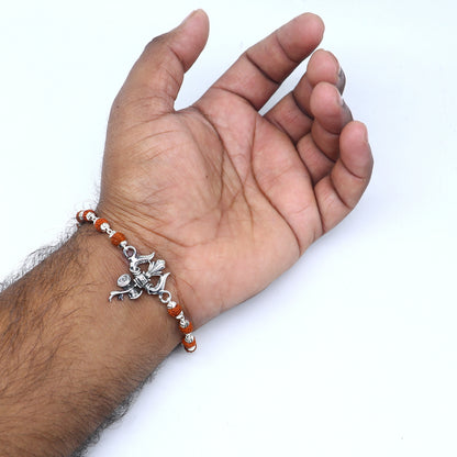 925 Sterling silver Rudraksha beaded Lord Shiva trident bracelet with intricate details, designed by TRIBAL ORNAMENTS.