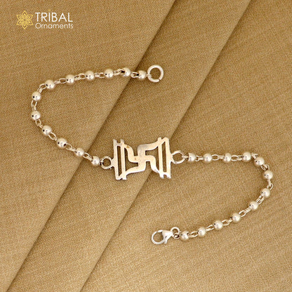 Sterling silver Swastik design Rudraksh and black tulsi beads bracelet rakhi with silver beads by TRIBAL ORNAMENTS.