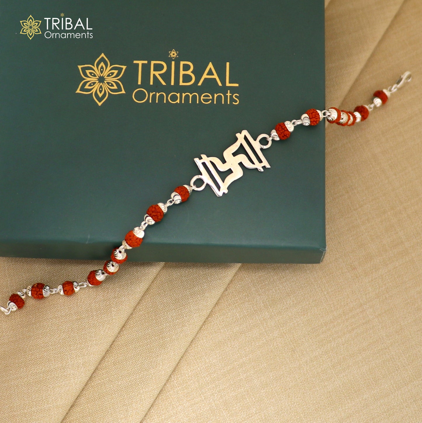Sterling silver Swastik design Rudraksh bracelet with black tulsi beads and silver beads, handcrafted by TRIBAL ORNAMENTS.