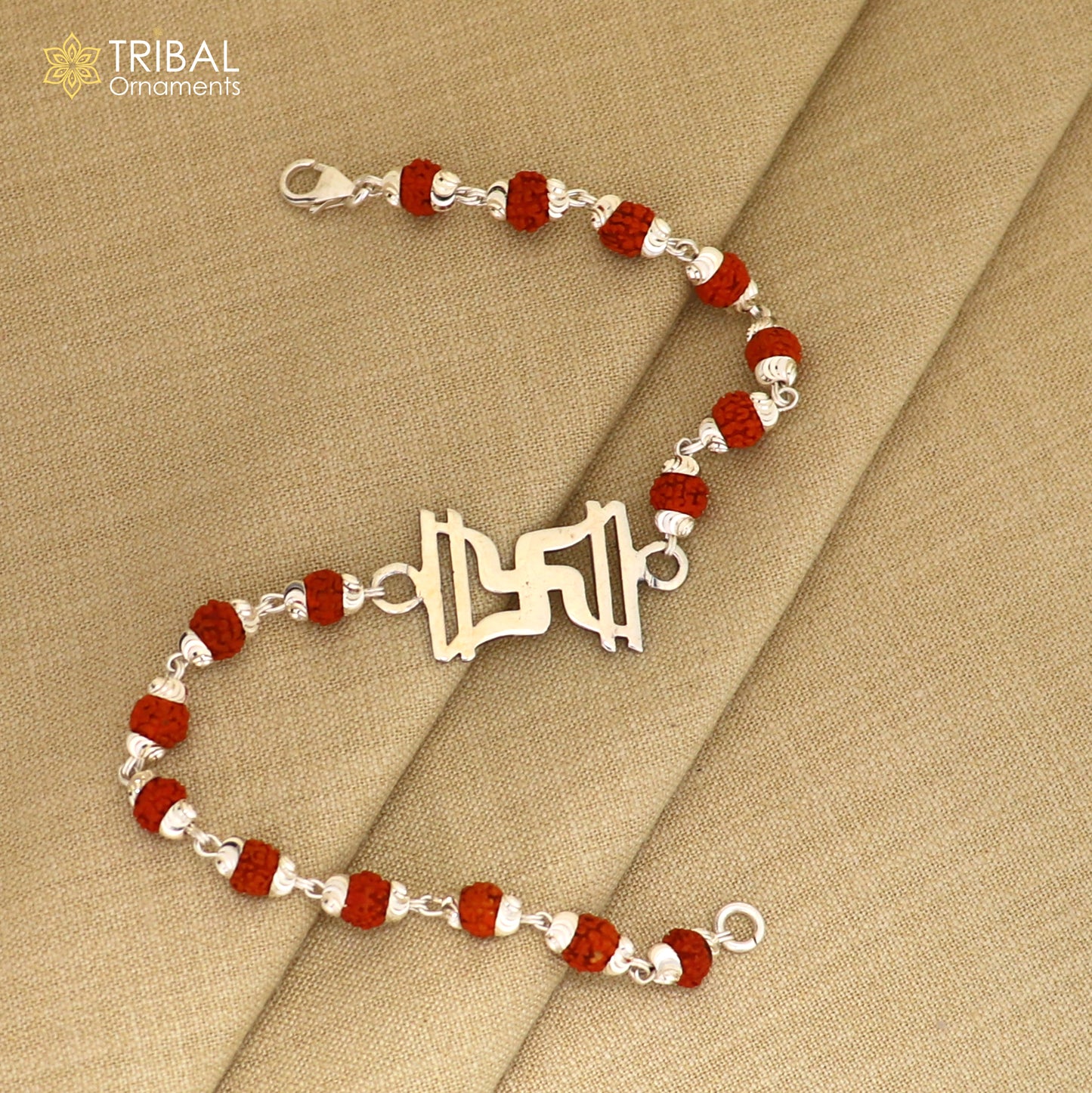 Sterling silver Swastik design Rudraksha bracelet with black Tulsi beads and silver beads, crafted by TRIBAL ORNAMENTS.