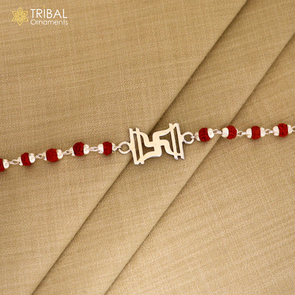 Sterling silver Swastik design Rudraksha and black tulsi beads bracelet Rakhi with silver beads, crafted by Tribal Ornaments.