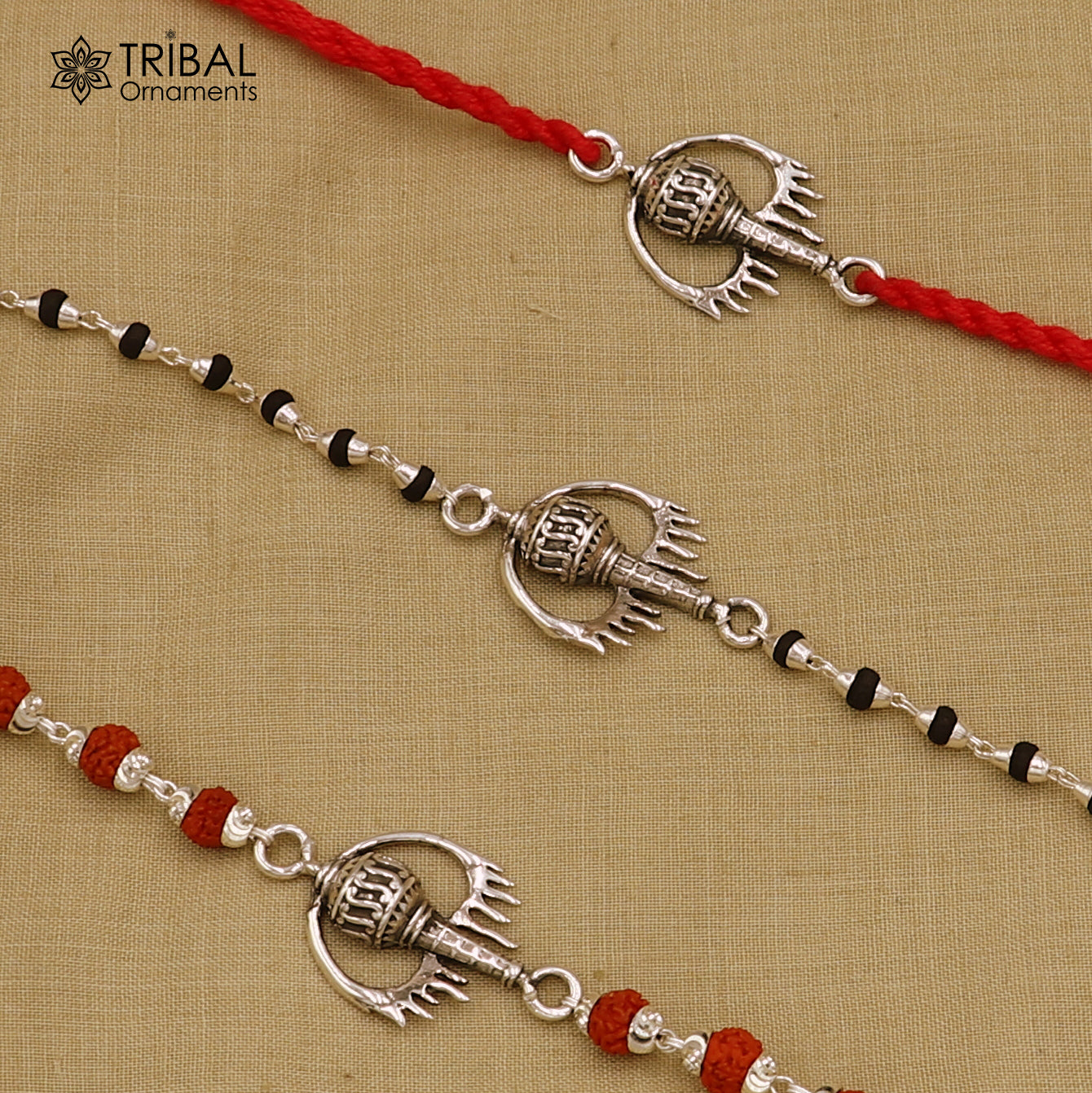 Sterling silver Hanuman weapon and Gota bracelet rakhi by TRIBAL ORNAMENTS, featuring intricate tribal silver design.