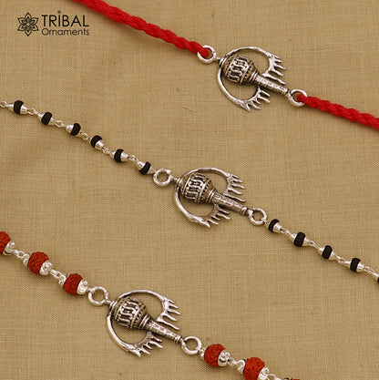 Sterling silver Hanuman weapon and Gota bracelet rakhi by TRIBAL ORNAMENTS, featuring intricate tribal silver design.